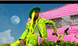 MacBook Air screen showing photo of person in colourful outfit, demonstrating colour range and resolution of Liquid Retina display